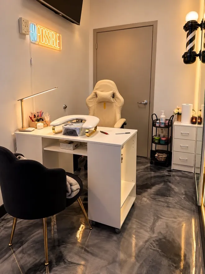 Nail station and pedicure chair inside Legacy Nail Studio, a nail salon in South Austin, TX