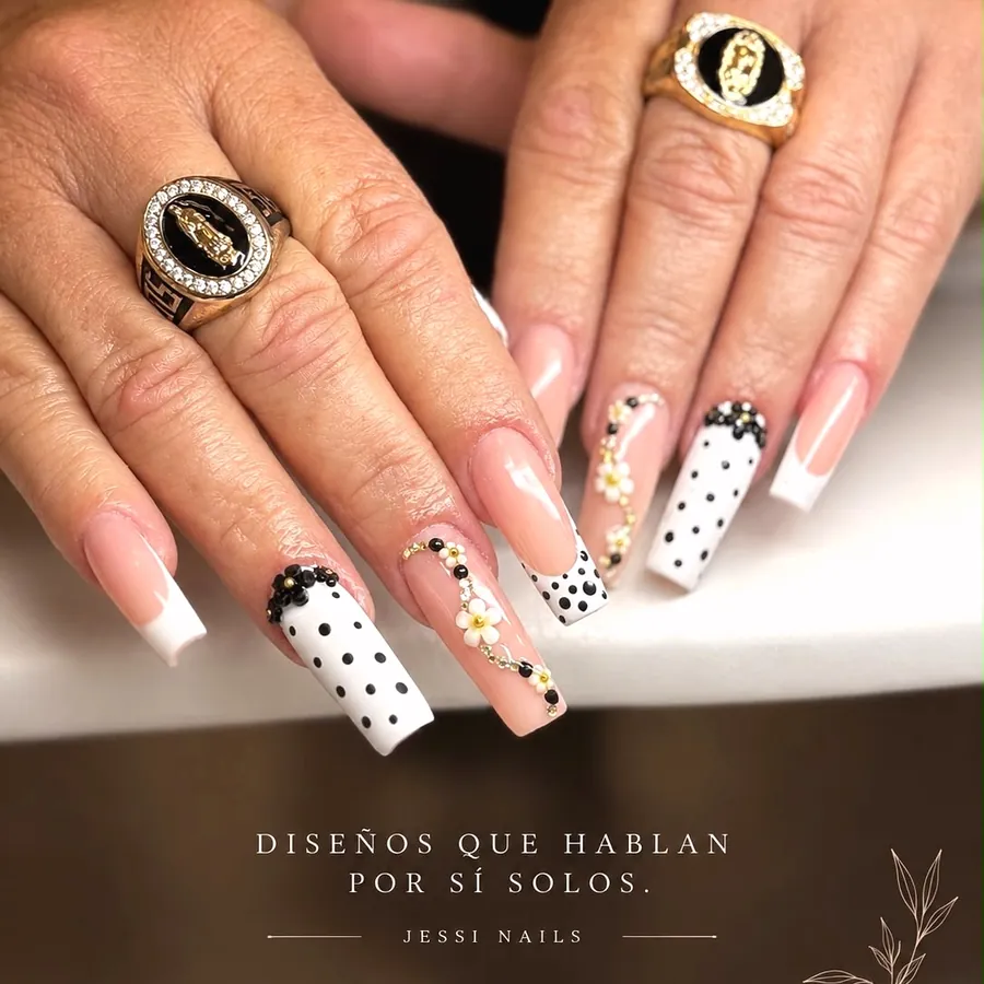 Long coffin acrylic nails with white French tips, polka dots and flower accents by Legacy Nail Studio, South Austin TX