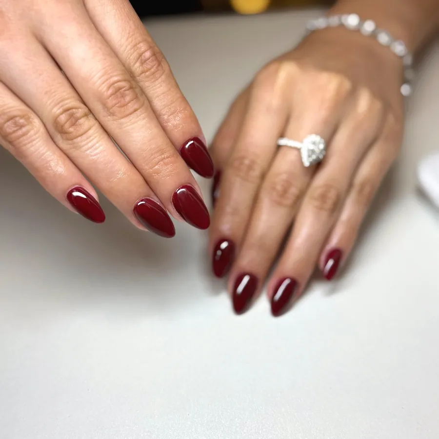 Burgundy gel manicure on almond nails at Legacy Nail Studio, South Austin TX