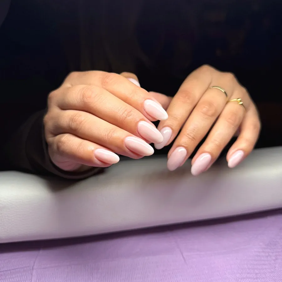 Milky pink gel manicure on almond nails at Legacy Nail Studio, South Austin TX