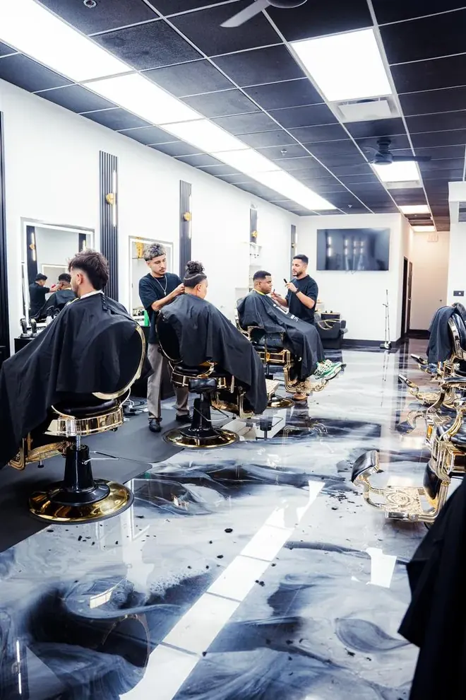 Legacy Barbershop barbers at work with clients