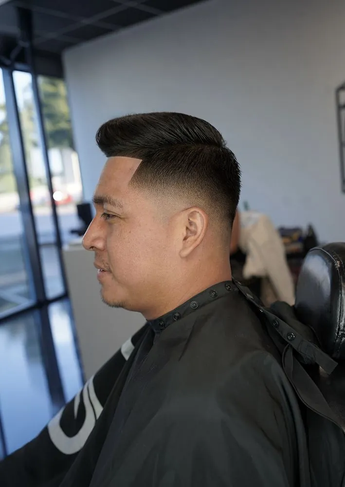 Classic pompadour with mid fade by Legacy Barbershop
