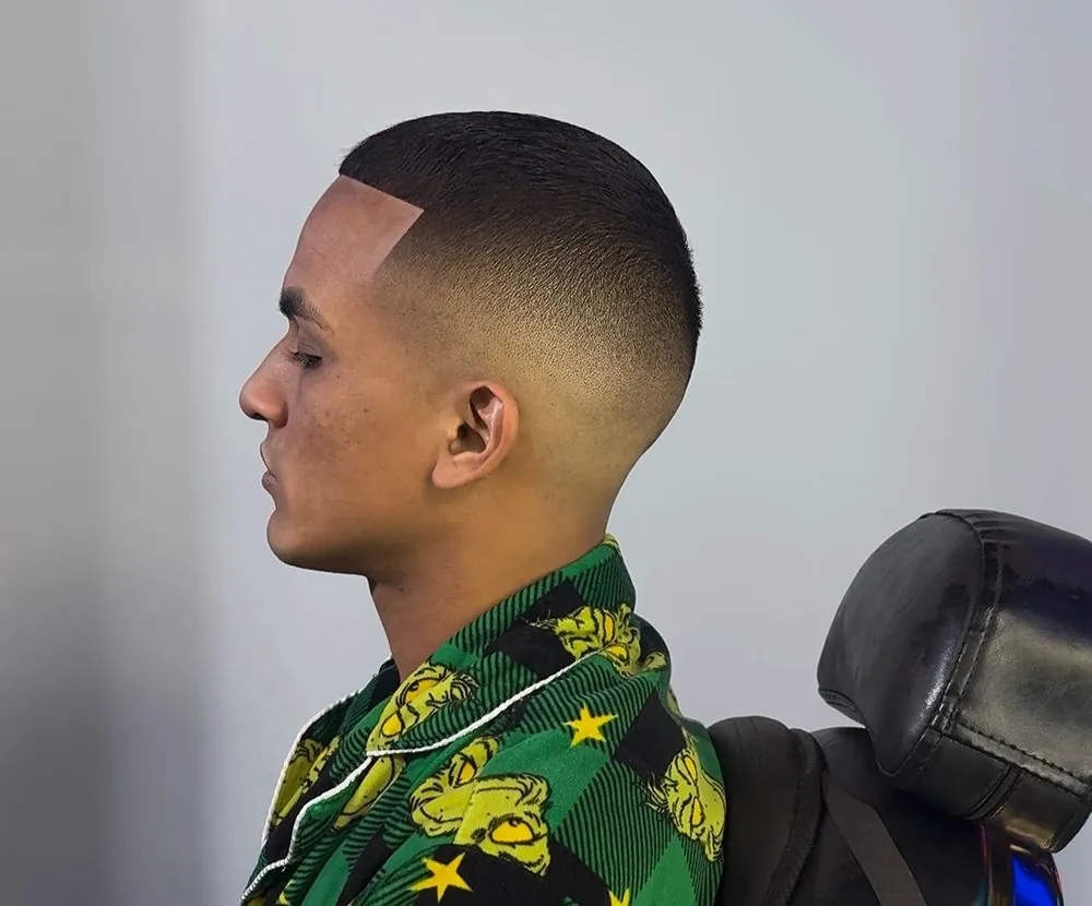 Buzz cut with skin fade and crisp line-up by Legacy Barbershop